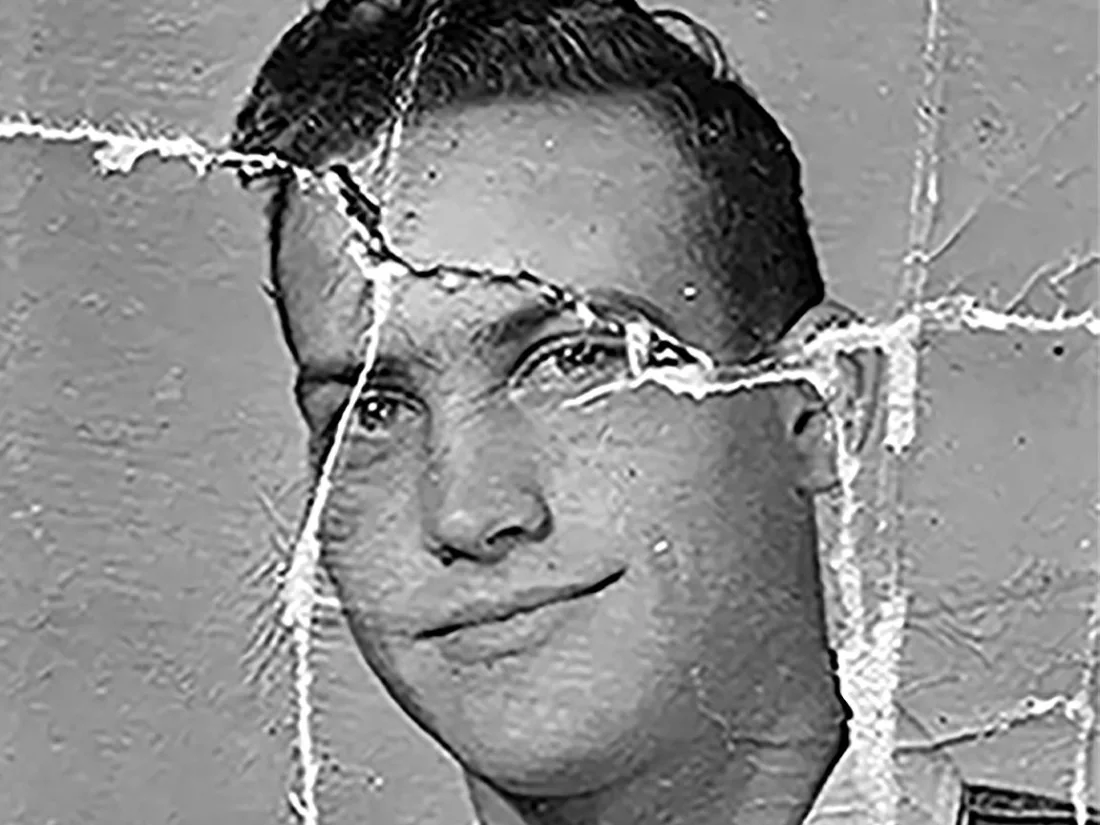 Damaged old photo before AI restoration — visible scratches, fading, and color loss